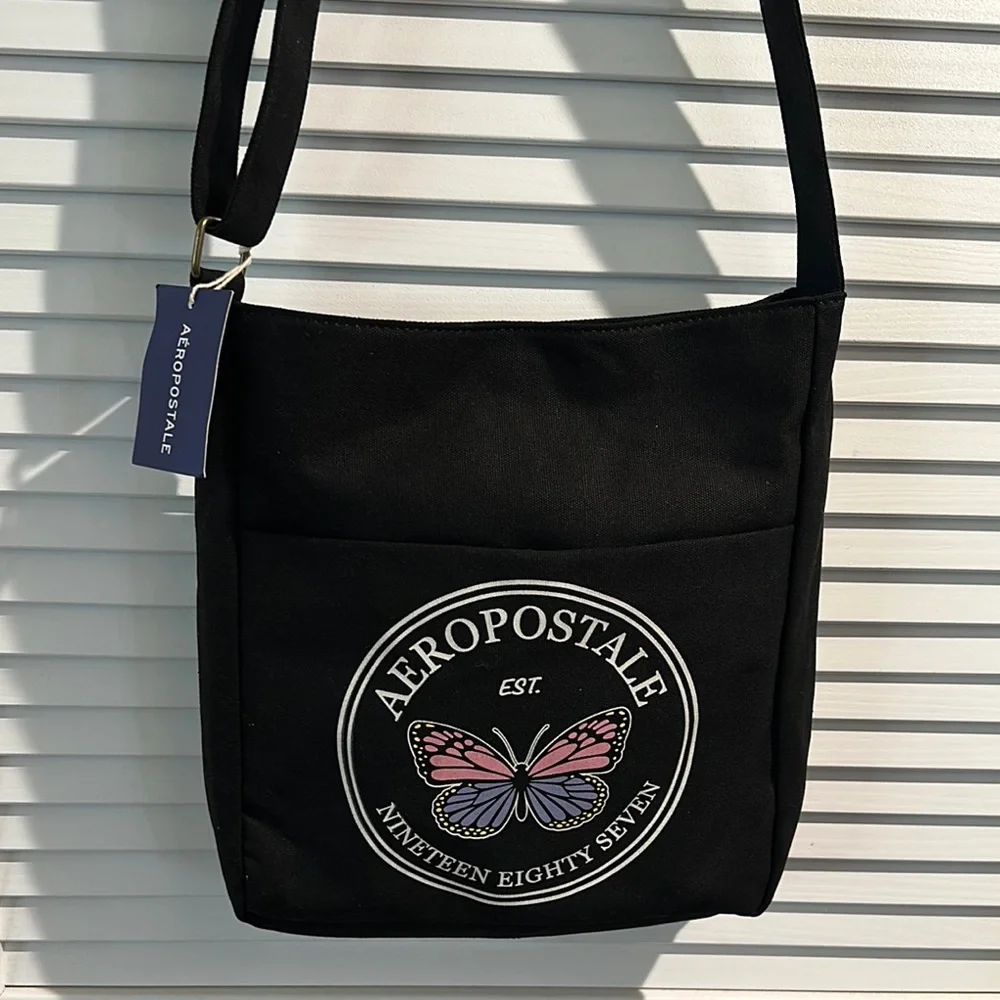 NWT Aeropostale 1987 Black Canvas Crossbody bag with adjustable Strap.